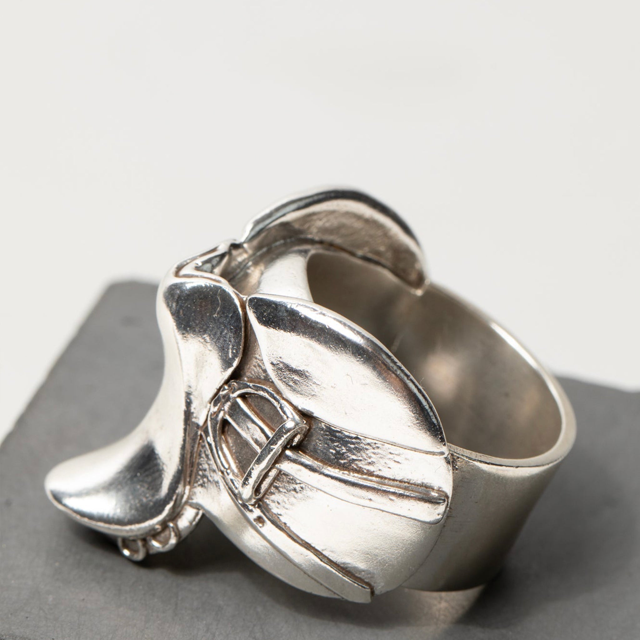 Detailed product image of a sculptural equine ring from our horse jewelry collection, showcasing its high polish and bold silhouette
